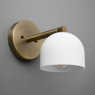 Brushed brass wall sconce with white dome-shaped metal shade and exposed bulb. - Sconce Model No. 5356