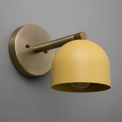 Matte brass wall sconce with a mustard yellow dome-shaped metal shade and a single exposed bulb. - Sconce Model No. 5356