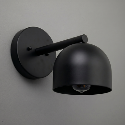 Matte black metal wall sconce with a rounded deep dome shade and exposed bulb design. - Sconce Model No. 5356