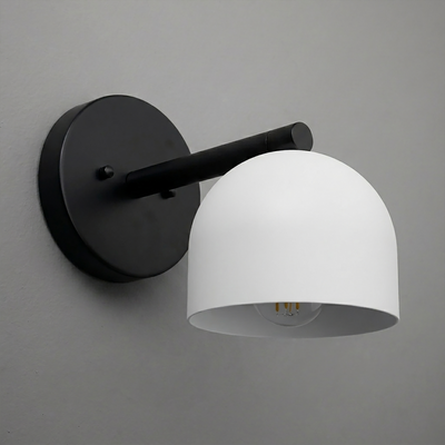 Matte black wall sconce with a curved arm and a smooth white dome-shaped shade. - Sconce Model No. 5356