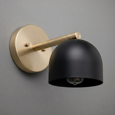 Matte black dome-shaped sconce with brushed brass arm and round wall mount. - Sconce Model No. 5356