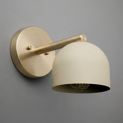 Brushed brass wall sconce with round backplate and matte cream dome-shaped shade, single bulb design. - Sconce Model No. 5356