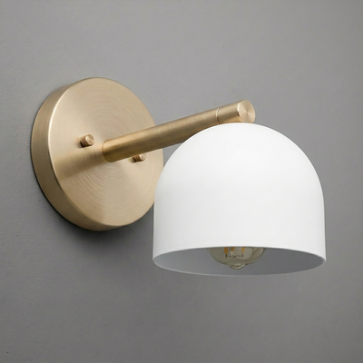 Wall sconce with matte gold round base and arm, featuring a smooth white dome-shaped shade. - Sconce Model No. 5356
