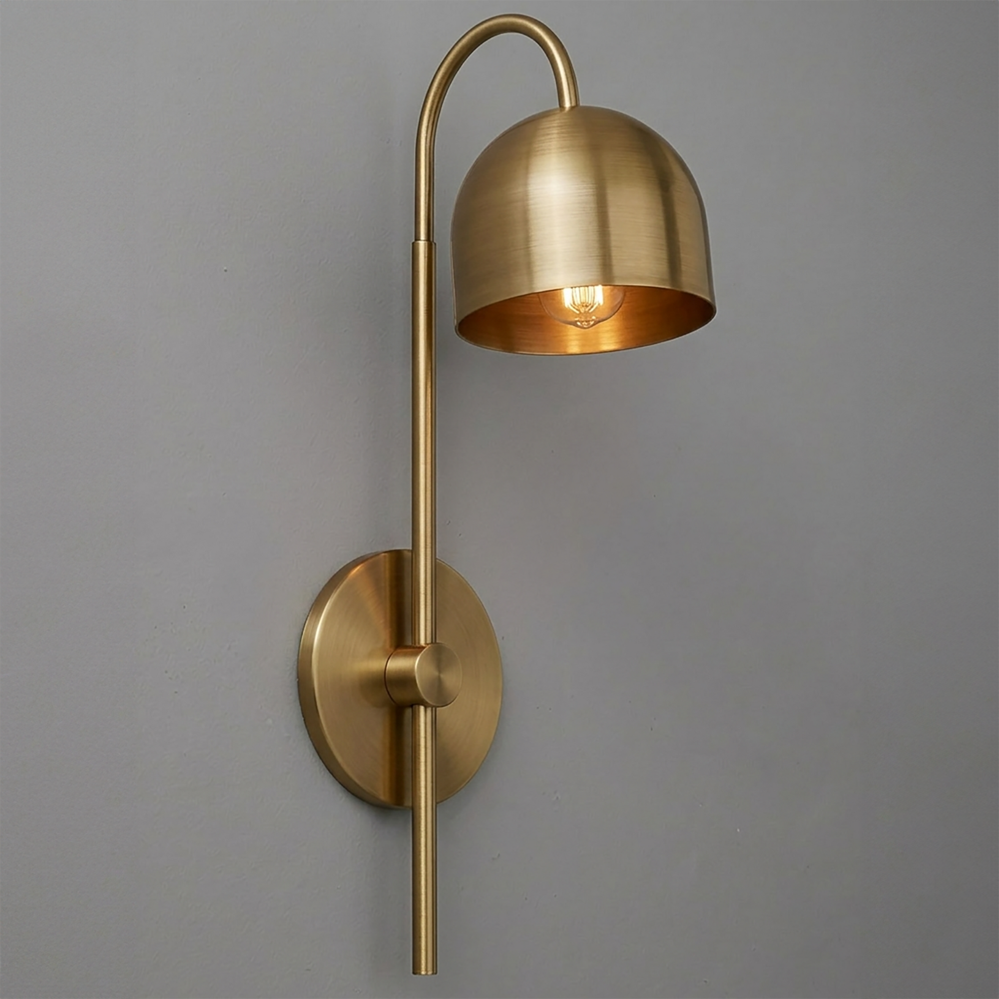 Brushed brass single-bulb wall sconce with dome-shaped shade and curved arm. - Sconce Model No. 7340