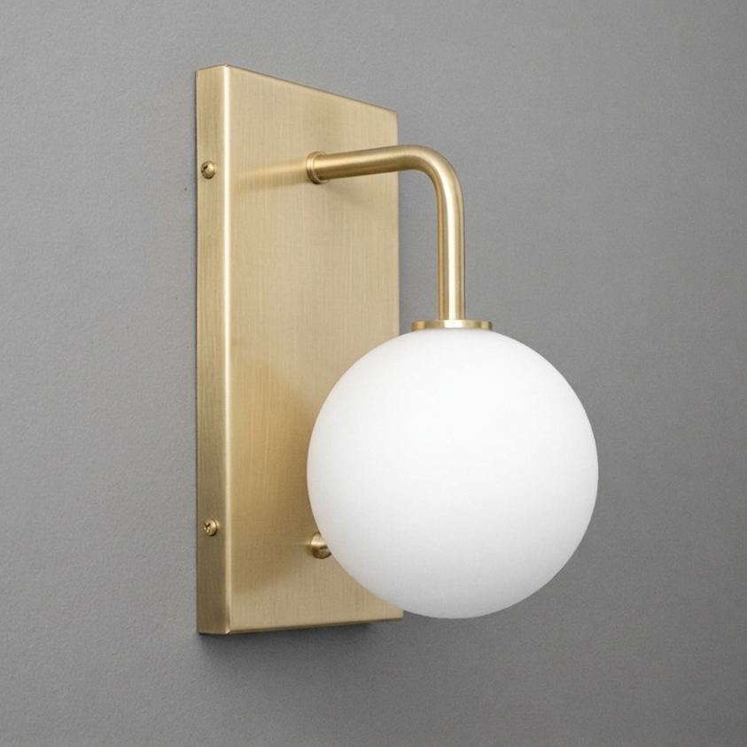 Brushed brass wall sconce with rectangular backplate and white frosted glass globe shade. - SCONCE MODEL NO. 9002