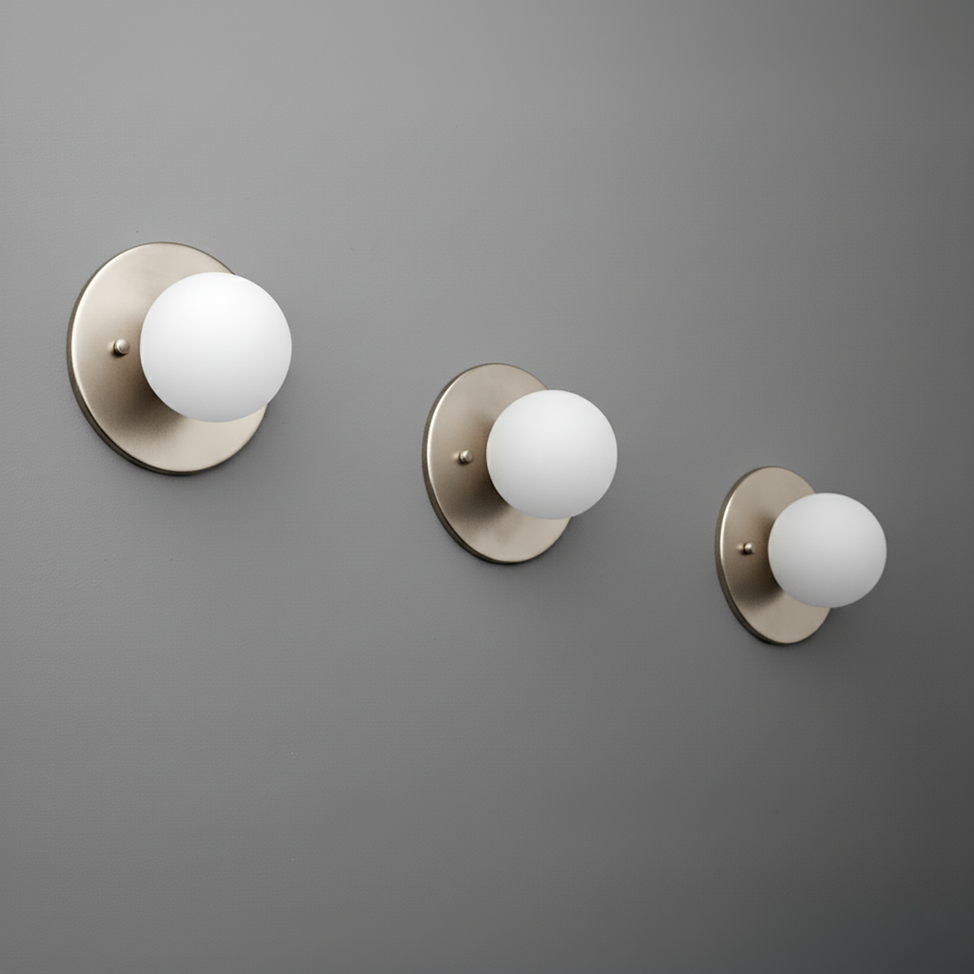Brushed nickel sconce with frosted white 3-inch globe on round backplate, mounted on gray wall. - Sconce Model No. 5206