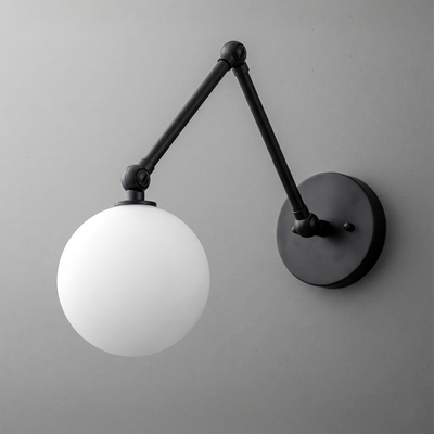 Black metal adjustable arm wall sconce with a white frosted globe shade and round wall mount. - SCONCE MODEL NO. 5202