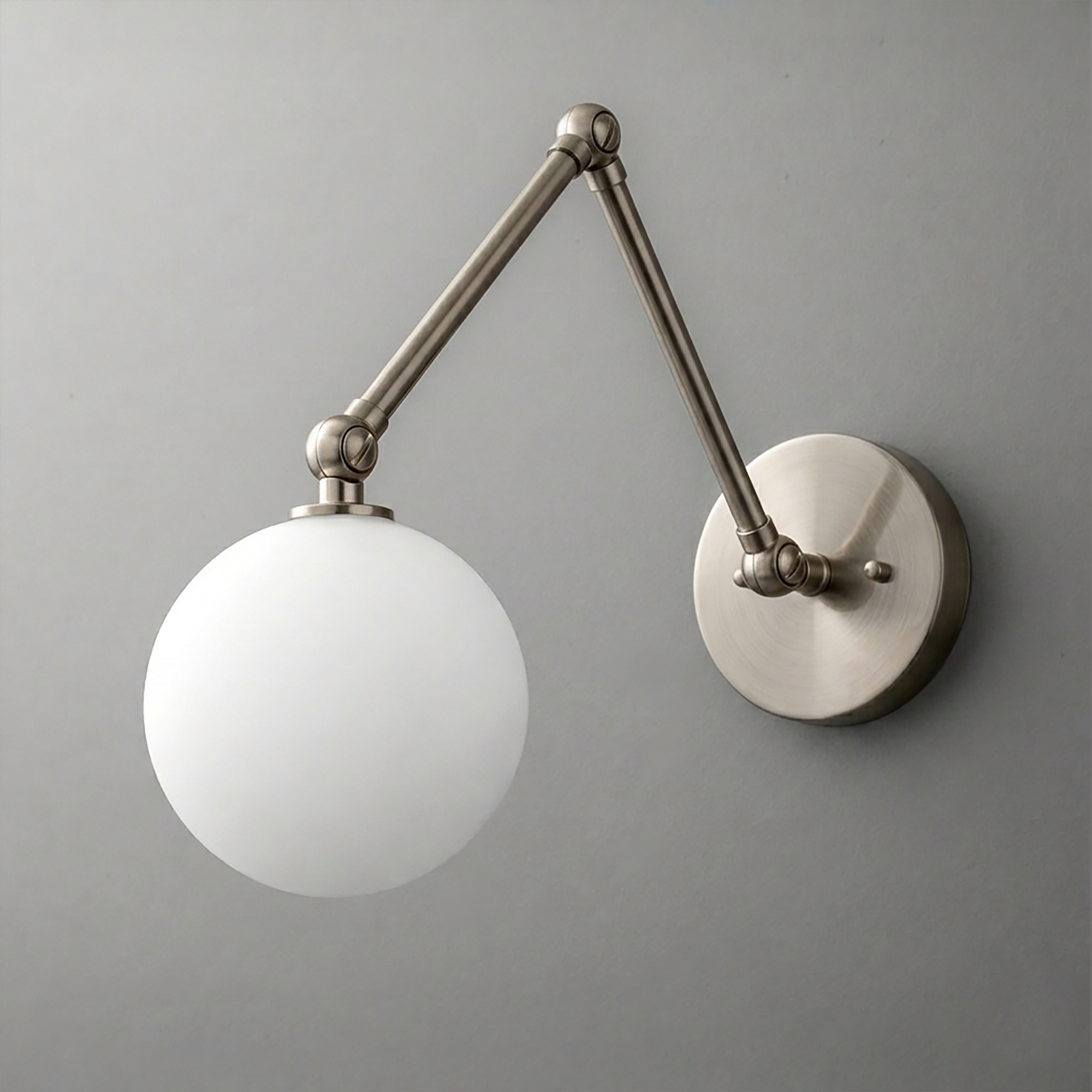 Brushed nickel wall sconce with adjustable articulated arm and frosted white globe shade. - SCONCE MODEL NO. 5202