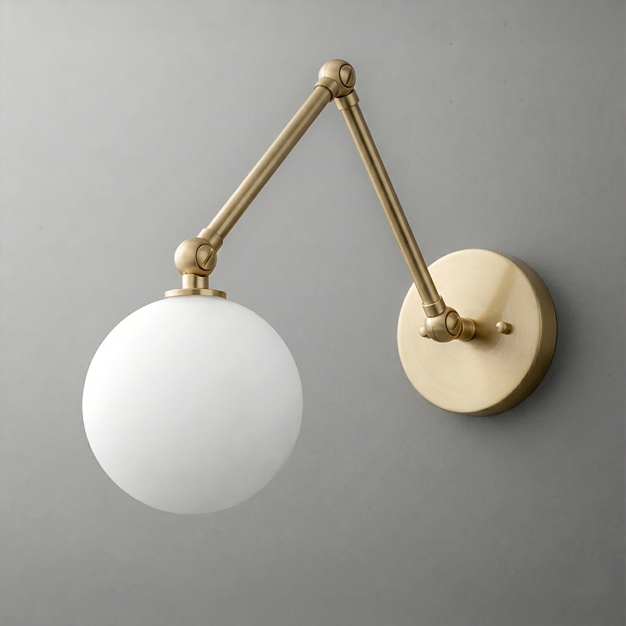 Wall-mounted sconce with matte brass adjustable arm and frosted white globe shade. - SCONCE MODEL NO. 5202