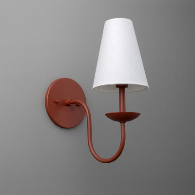 Matte rust-colored metal wall sconce with curved arm and white tapered fabric shade. - SCONCE MODEL NO. 7085