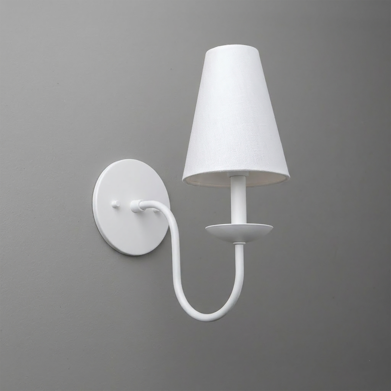 White metal wall sconce with curved arm and tapered fabric lampshade. - SCONCE MODEL NO. 7085