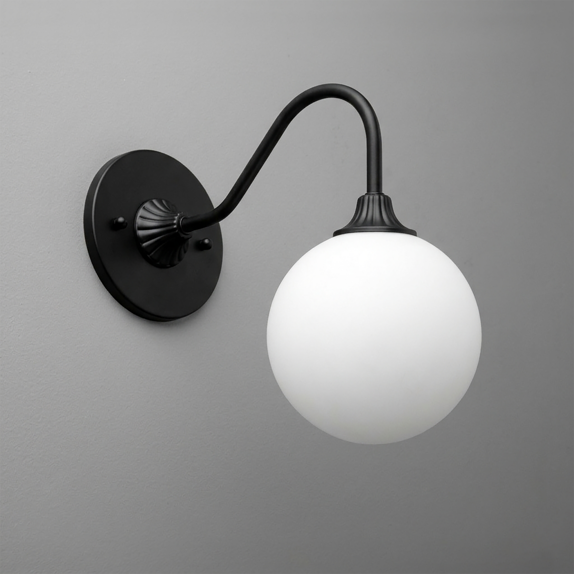 Black metal wall sconce with curved arm and frosted white glass globe shade. - SCONCE MODEL NO. 8263