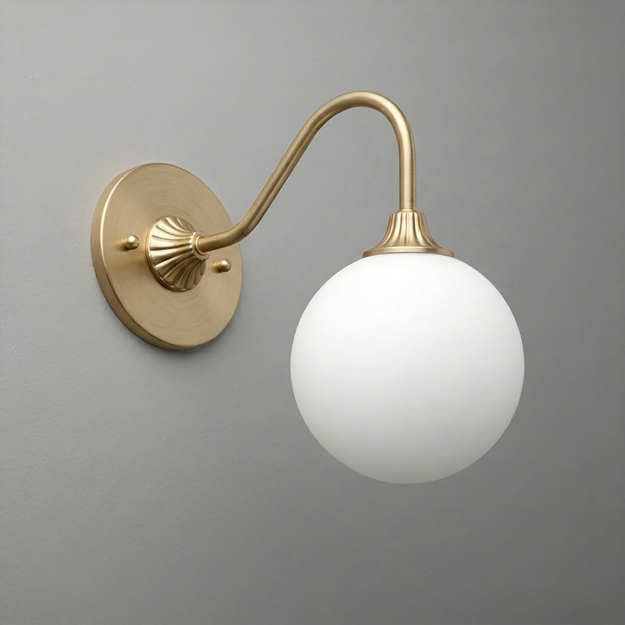 Wall-mounted brass sconce with curved arm and frosted white globe shade. - SCONCE MODEL NO. 8263