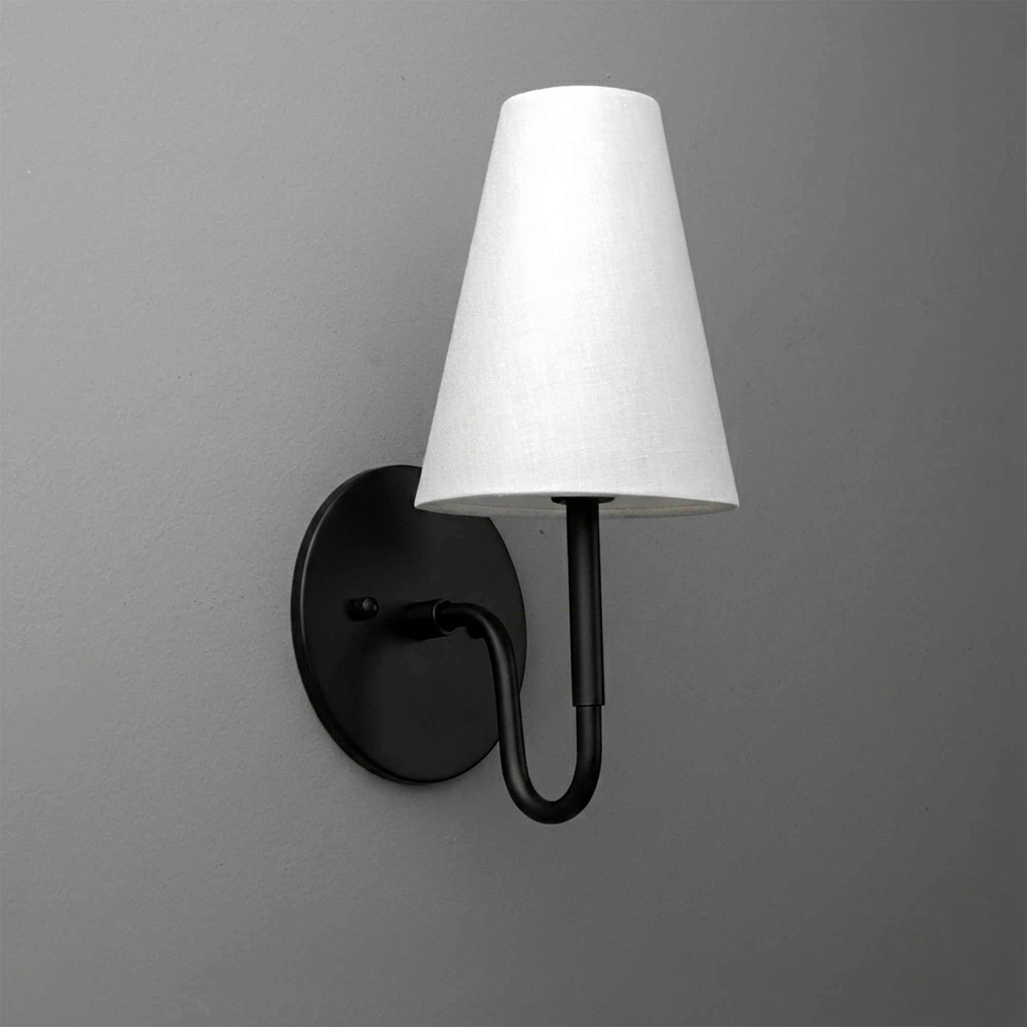 Black metal wall sconce with curved arm and white tapered fabric shade. - SCONCE MODEL NO. 1699