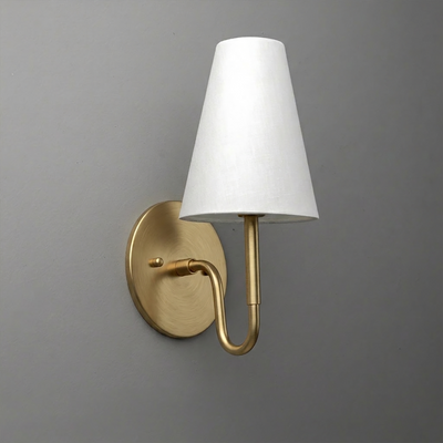 Brushed gold metal wall sconce with a curved arm and white tapered fabric shade. - SCONCE MODEL NO. 1699