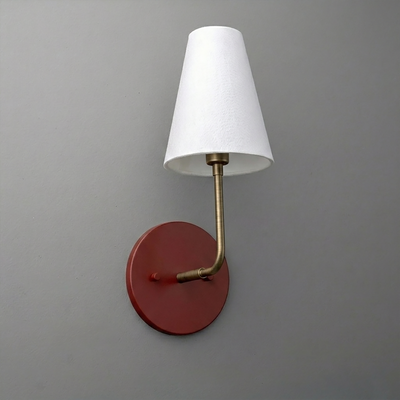 Wall sconce with round red metal base, brass arm, and white tapered fabric shade. - SCONCE MODEL NO. 3928