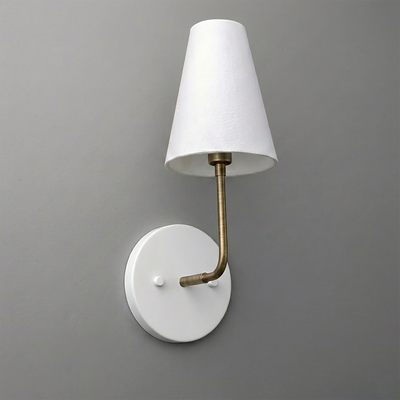 White round wall sconce with brass curved arm and white tapered fabric shade. - SCONCE MODEL NO. 3928