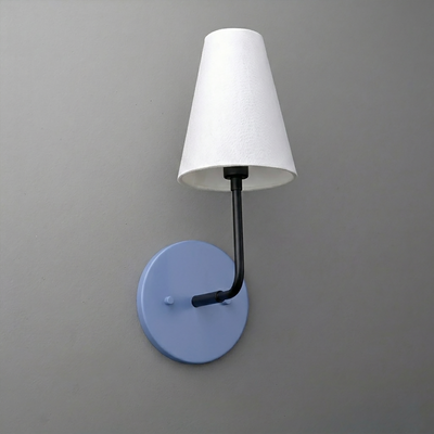 Wall sconce with a round blue base, black curved arm, and white tapered fabric shade. - SCONCE MODEL NO. 3928