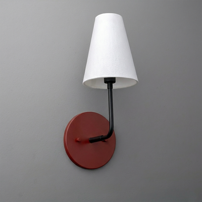 Wall sconce with a red circular metal base and black arm, topped with a white fabric cone-shaped shade. - SCONCE MODEL NO. 3928