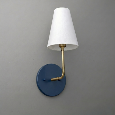 Wall-mounted sconce with navy blue round base, brass arm, and white tapered fabric shade. - SCONCE MODEL NO. 3928