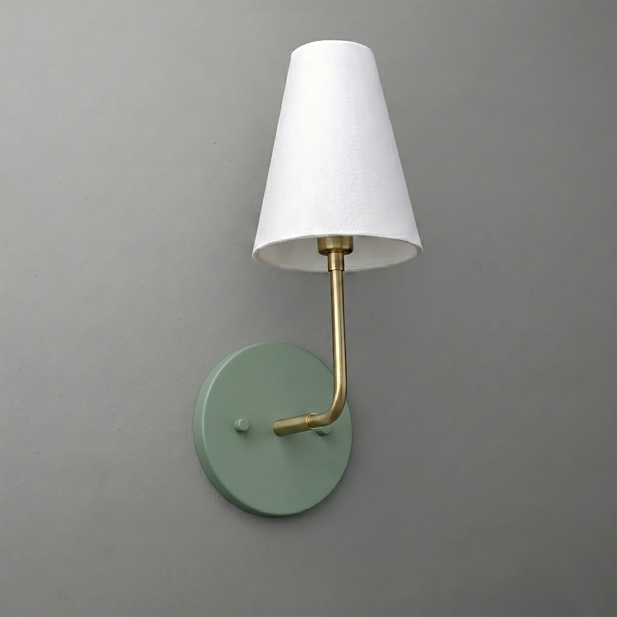 Wall sconce with matte green circular base, brass arm, and white tapered fabric shade. - SCONCE MODEL NO. 3928