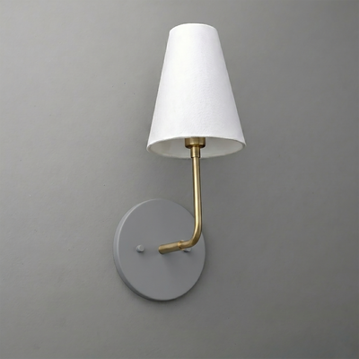 Wall-mounted sconce with round gray base, brass arm, and white tapered fabric shade. - SCONCE MODEL NO. 3928