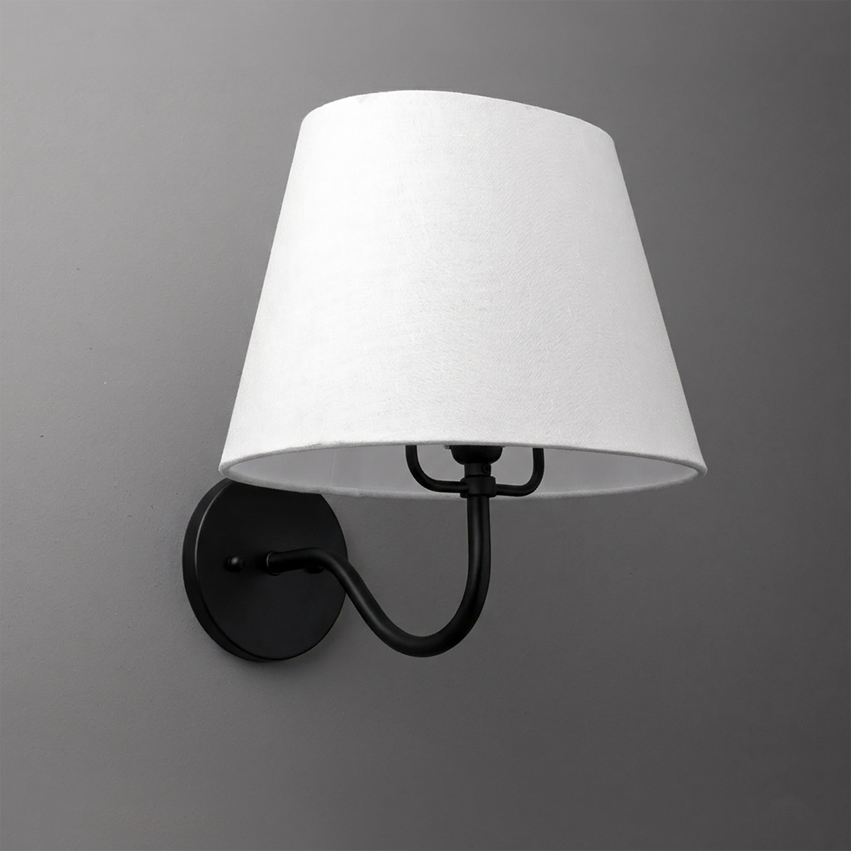 Black metal wall sconce with curved arm and white fabric tapered lampshade. - SCONCE MODEL NO. 0303