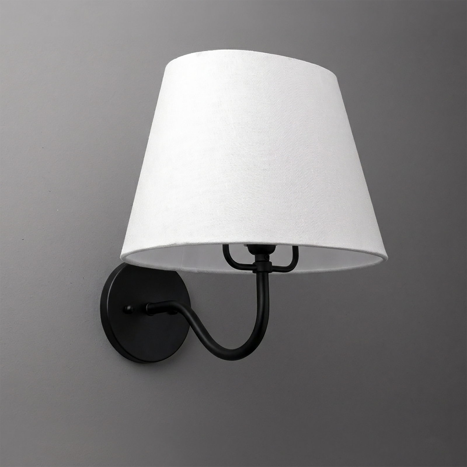 Black metal wall sconce with curved arm and white fabric tapered lampshade. - SCONCE MODEL NO. 0303