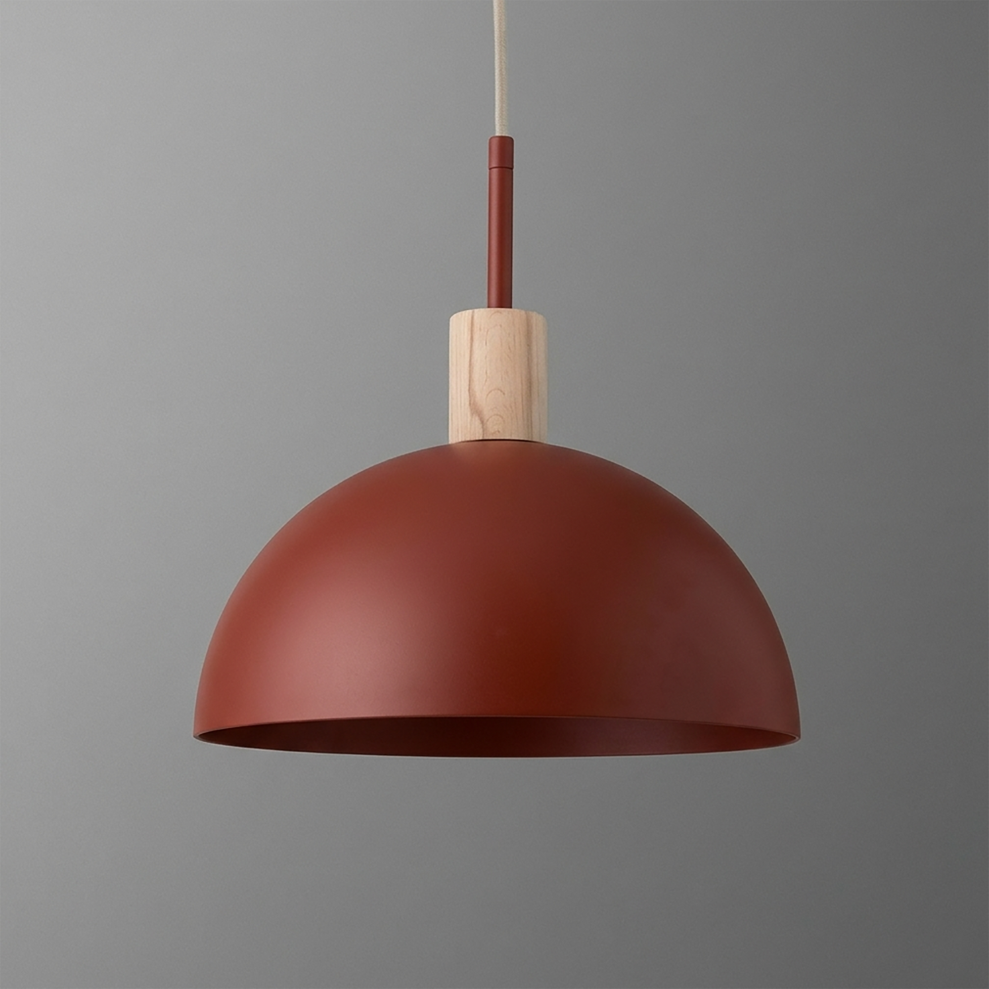 Matte rust-colored dome pendant light with natural wood accent and slender rod suspension. - PENDANT MODEL NO. 4610