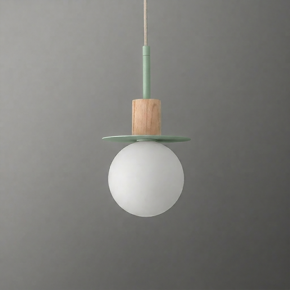 Minimalist pendant light with a frosted white globe, wooden cylindrical holder, and muted green metal disk accent. - PENDANT MODEL NO. 6198