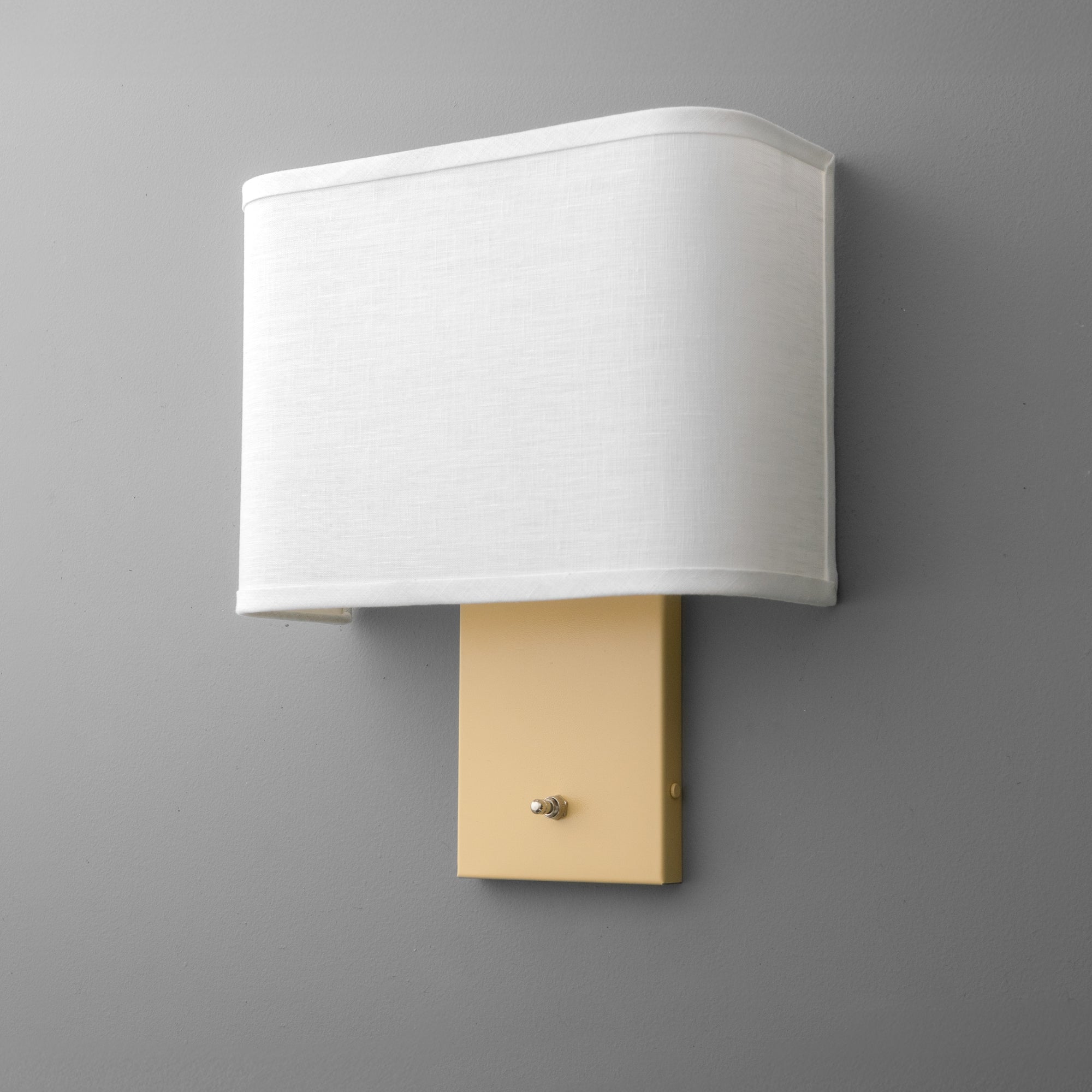 Rectangular white fabric shade wall sconce with beige metal base and single round switch knob. - SCONCE MODEL NO. 7769