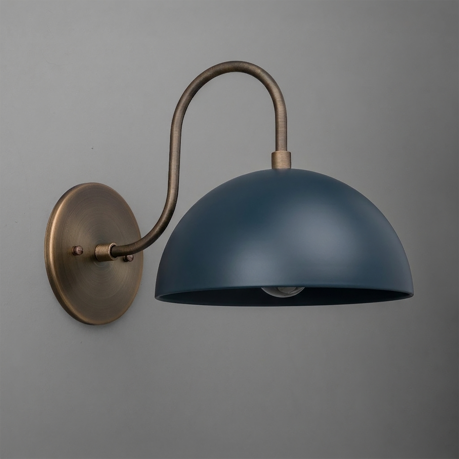 Wall-mounted sconce with aged brass arm and mounting plate, featuring a matte dark blue dome-shaped metal shade. - SCONCE MODEL NO. 9092