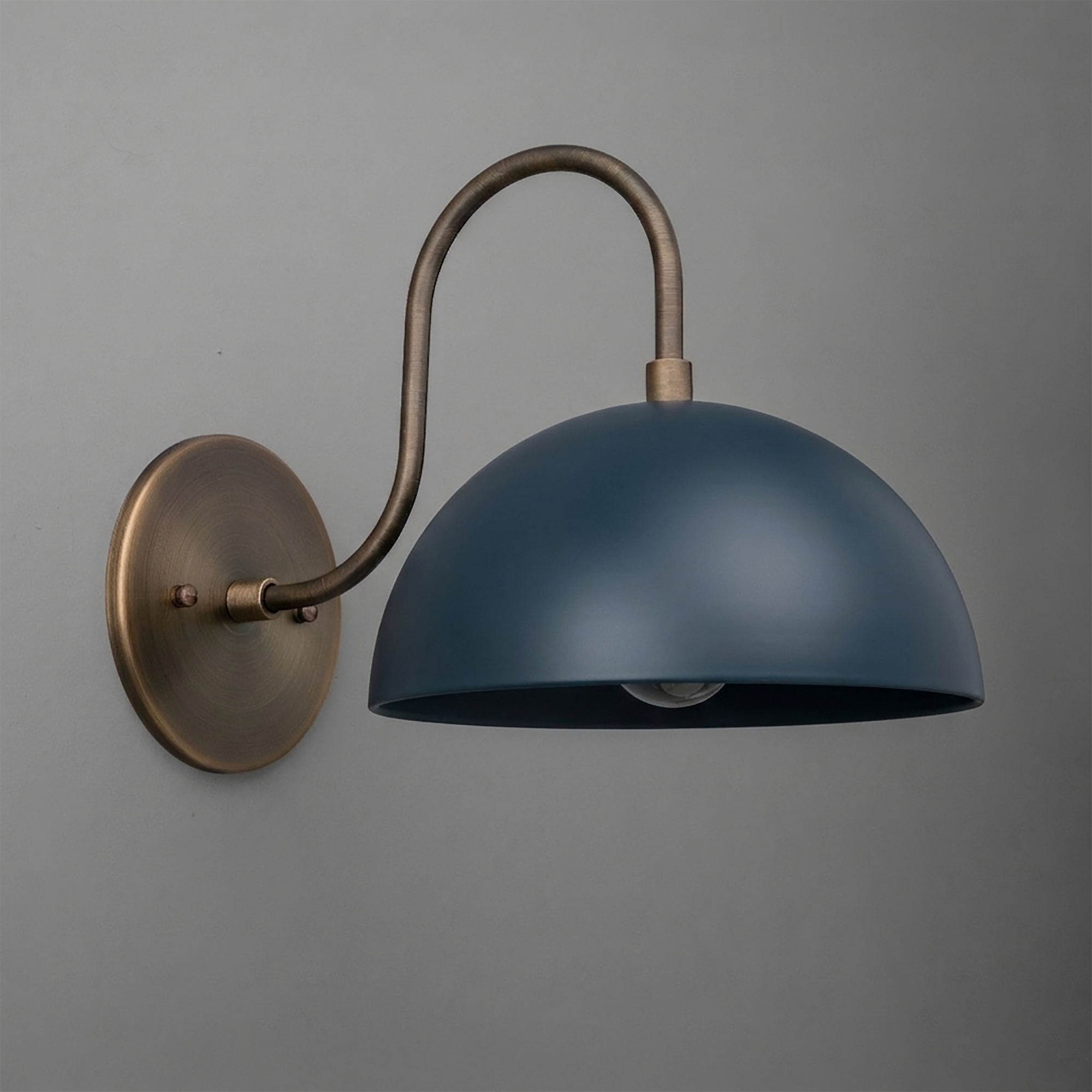 Wall-mounted sconce with aged brass arm and mounting plate, featuring a matte dark blue dome-shaped metal shade. - SCONCE MODEL NO. 9092