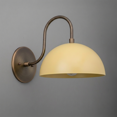 Wall-mounted bronze sconce with a curved arm and a smooth, dome-shaped cream glass shade. - SCONCE MODEL NO. 9092