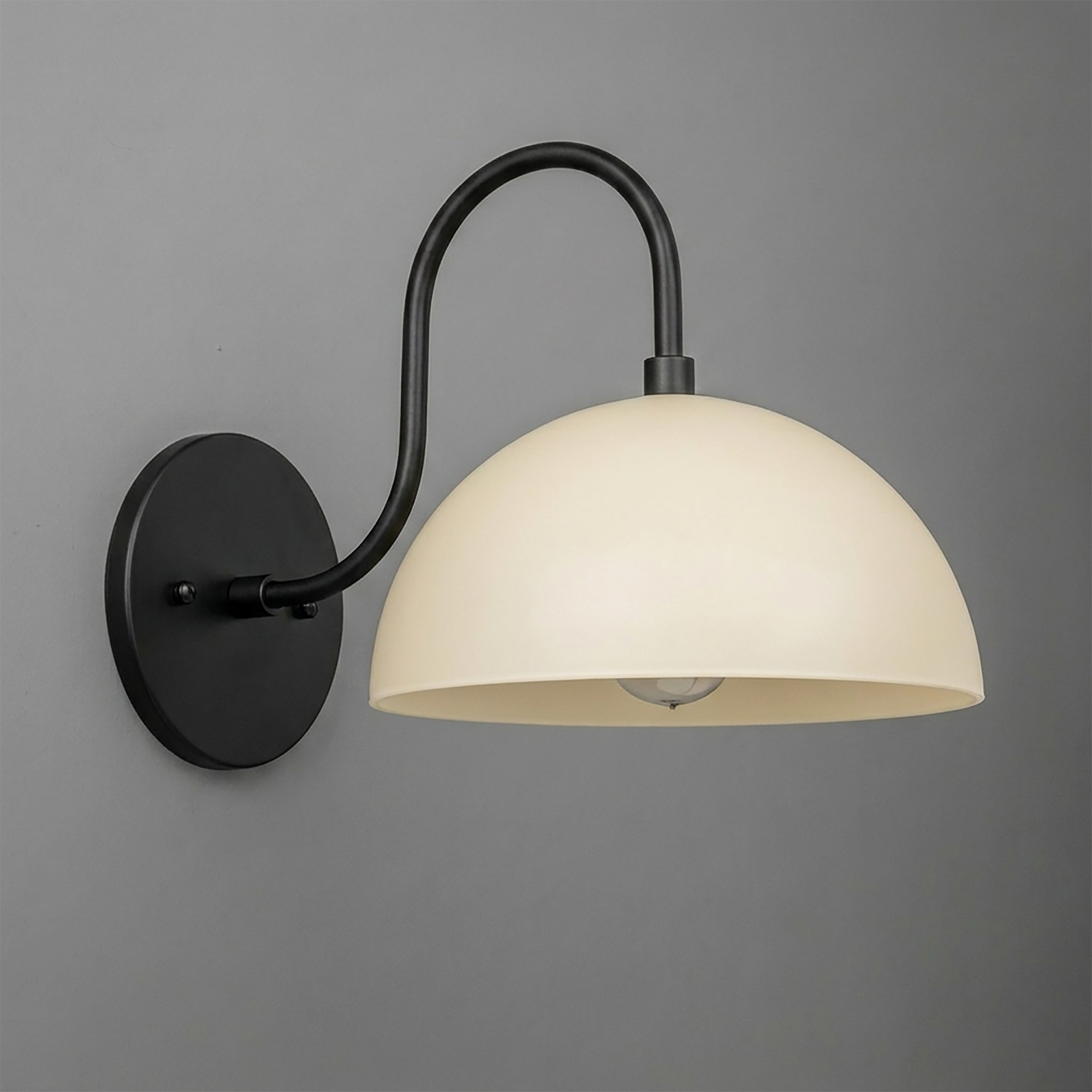 Black metal wall sconce with curved arm and a large white dome-shaped glass shade. - SCONCE MODEL NO. 9092