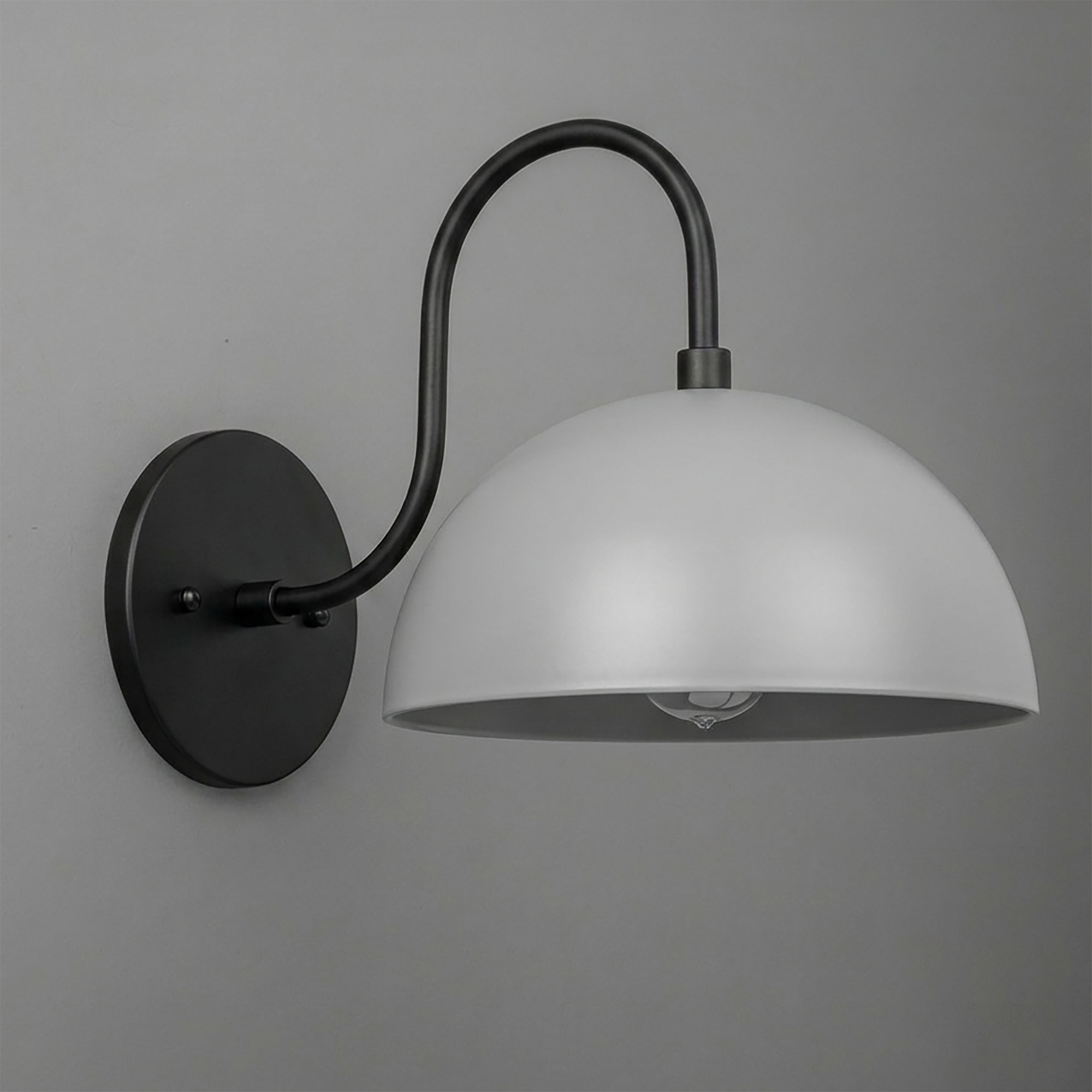 Matte black metal wall sconce with curved arm and wide white dome-shaped shade. - SCONCE MODEL NO. 9092