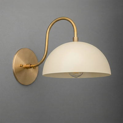 Matte white dome-shaped glass shade with a curved brass arm and round brass wall mount sconce. - SCONCE MODEL NO. 9092