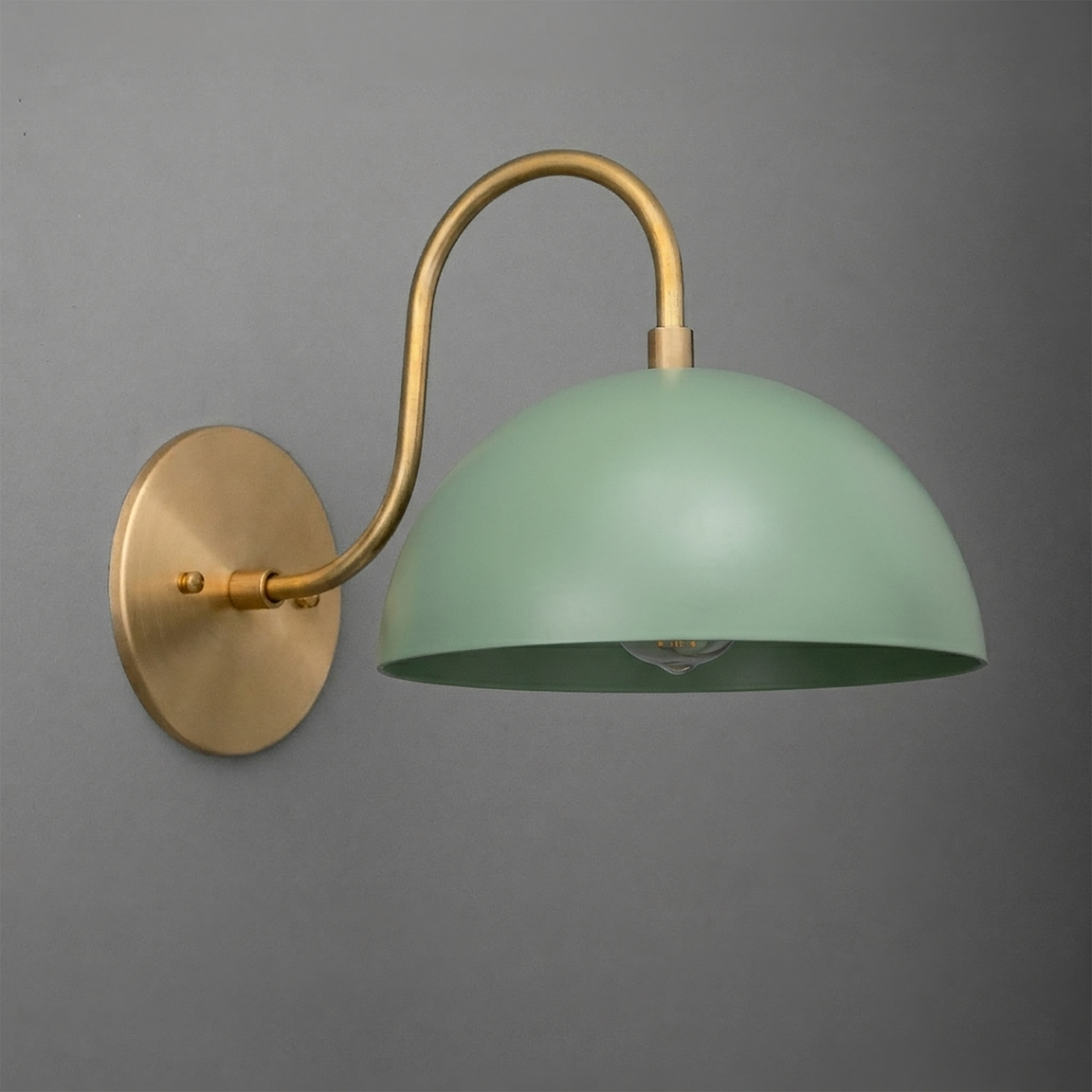 Wall-mounted sconce with curved brass arm and matte green dome-shaped metal shade. - SCONCE MODEL NO. 9092