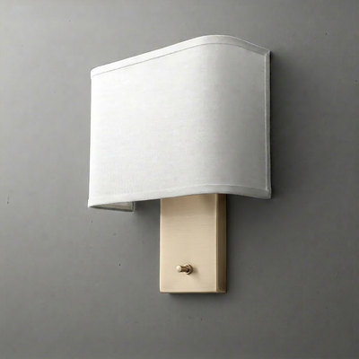Wall sconce with rectangular beige fabric shade and brushed brass rectangular base with toggle switch. - SCONCE MODEL NO. 1918