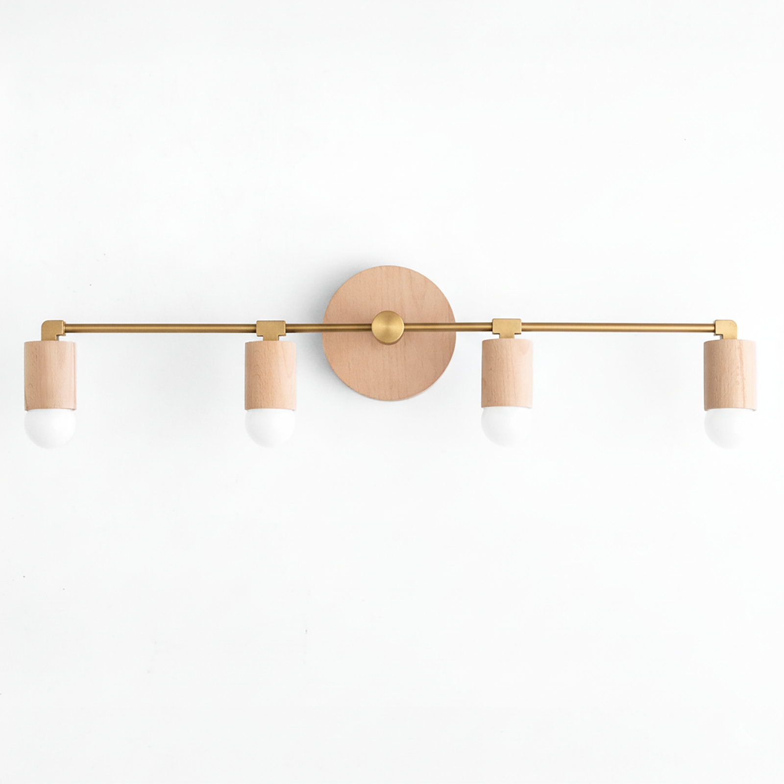 Four-bulb vanity light with raw brass finish and natural wood cylindrical sockets on wall mount. - VANITY LIGHT MODEL NO. 2017