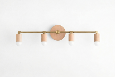 Four-bulb vanity light with natural wood base and brass-toned horizontal bar, white socket covers. - VANITY LIGHT MODEL NO. 2017