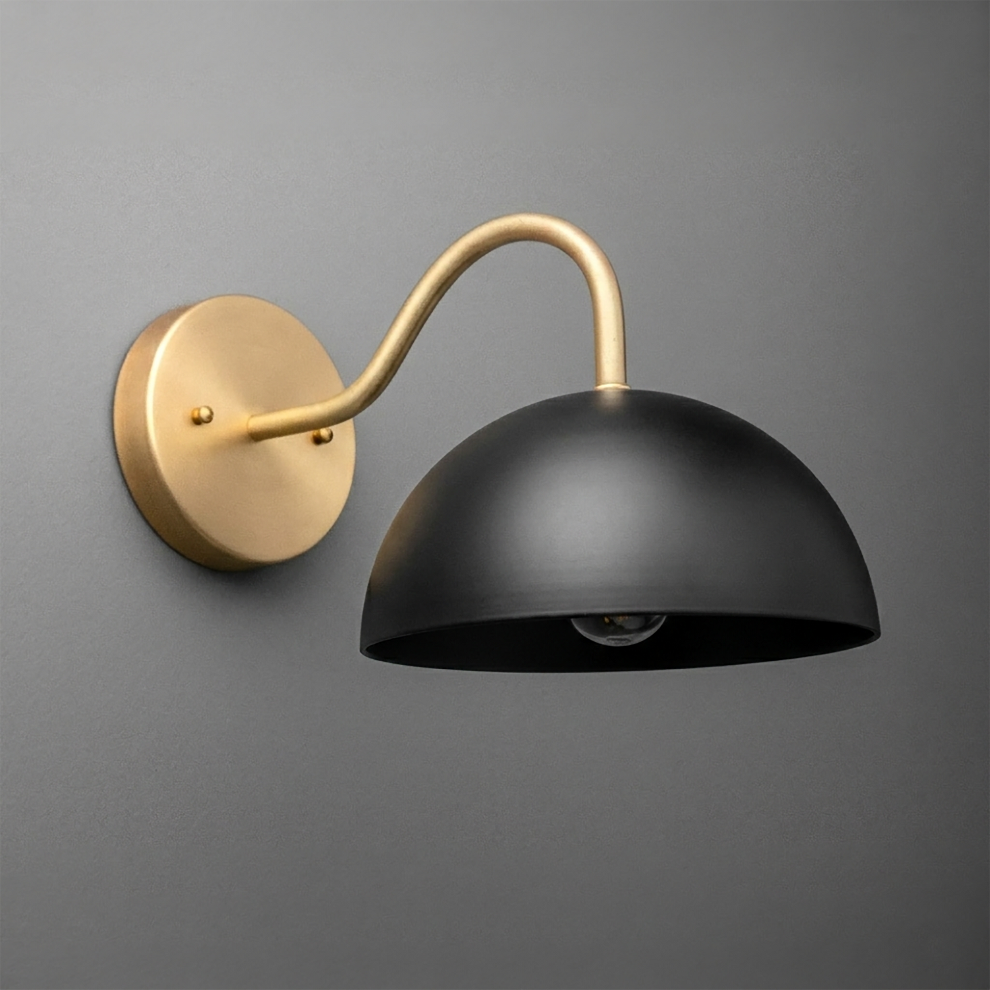 Matte black dome-shaped metal wall sconce with curved gold arm and round gold mounting plate. - SCONCE MODEL NO. 6678