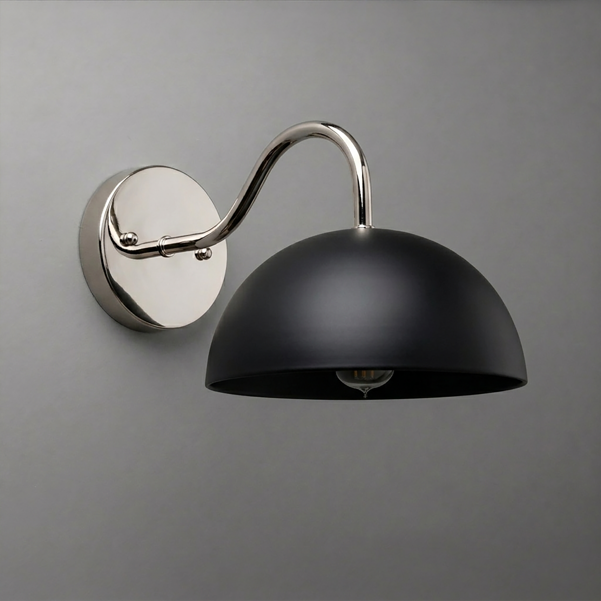 Black dome-shaped metal sconce with polished silver curved arm and round wall mount. - SCONCE MODEL NO. 6678