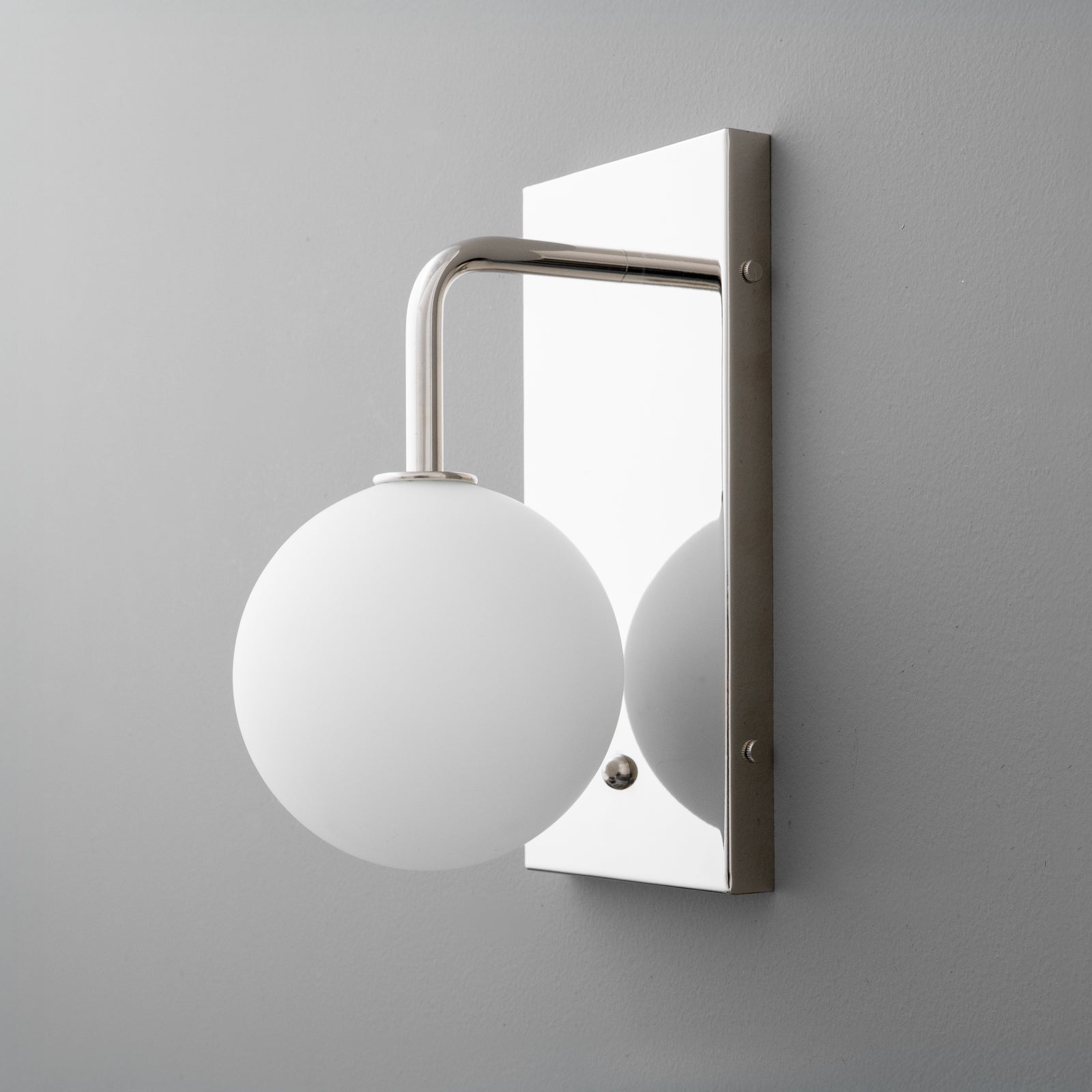 Polished nickel wall sconce with round white glass globe and rectangular backplate. - SCONCE MODEL NO. 9002