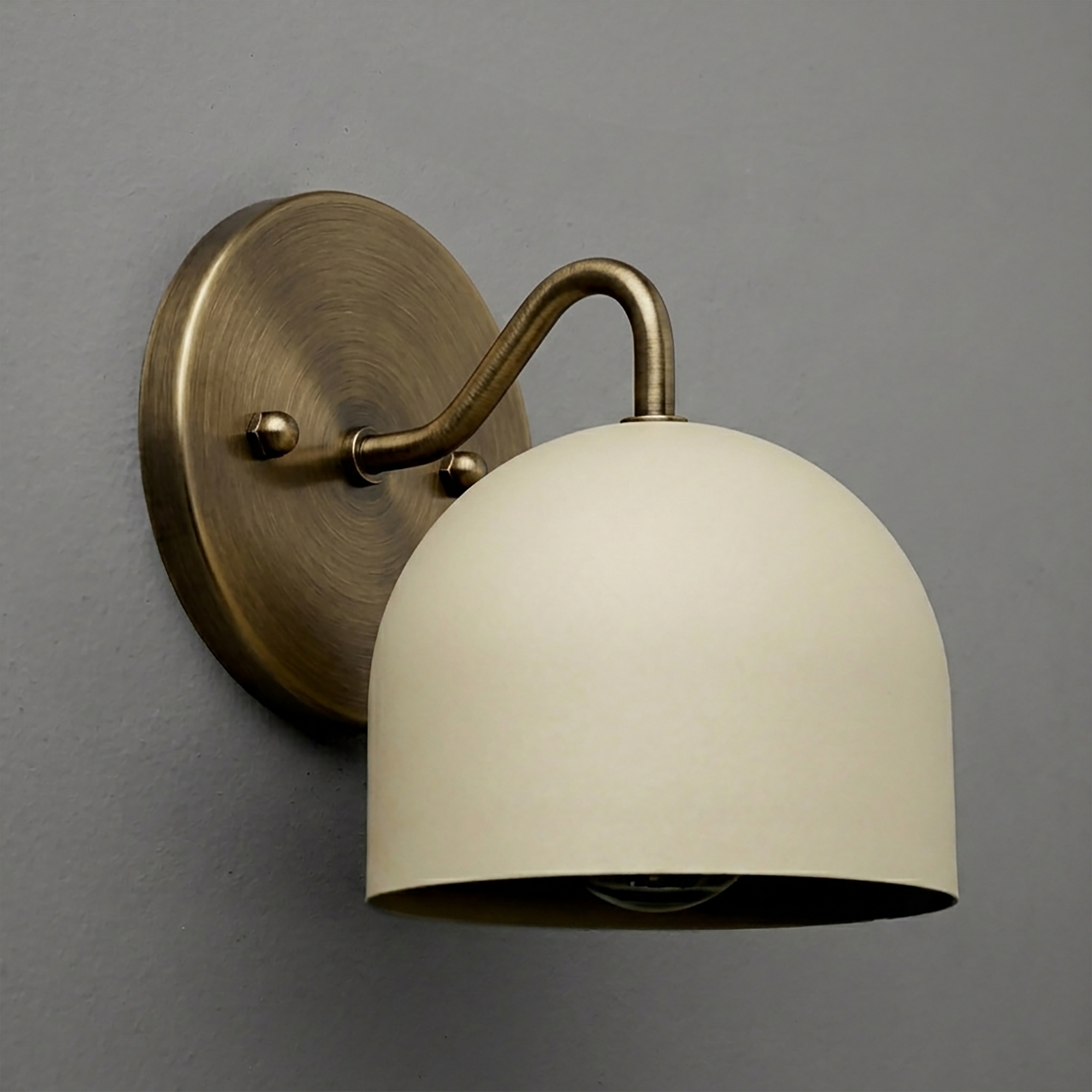 Wall-mounted sconce with aged brass finish and matte cream dome-shaped shade. - SCONCE MODEL NO. 9436