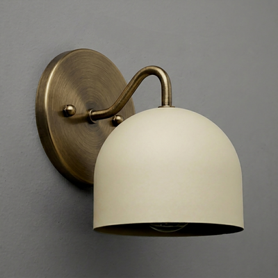 Wall-mounted sconce with aged brass finish and matte cream dome-shaped shade. - SCONCE MODEL NO. 9436