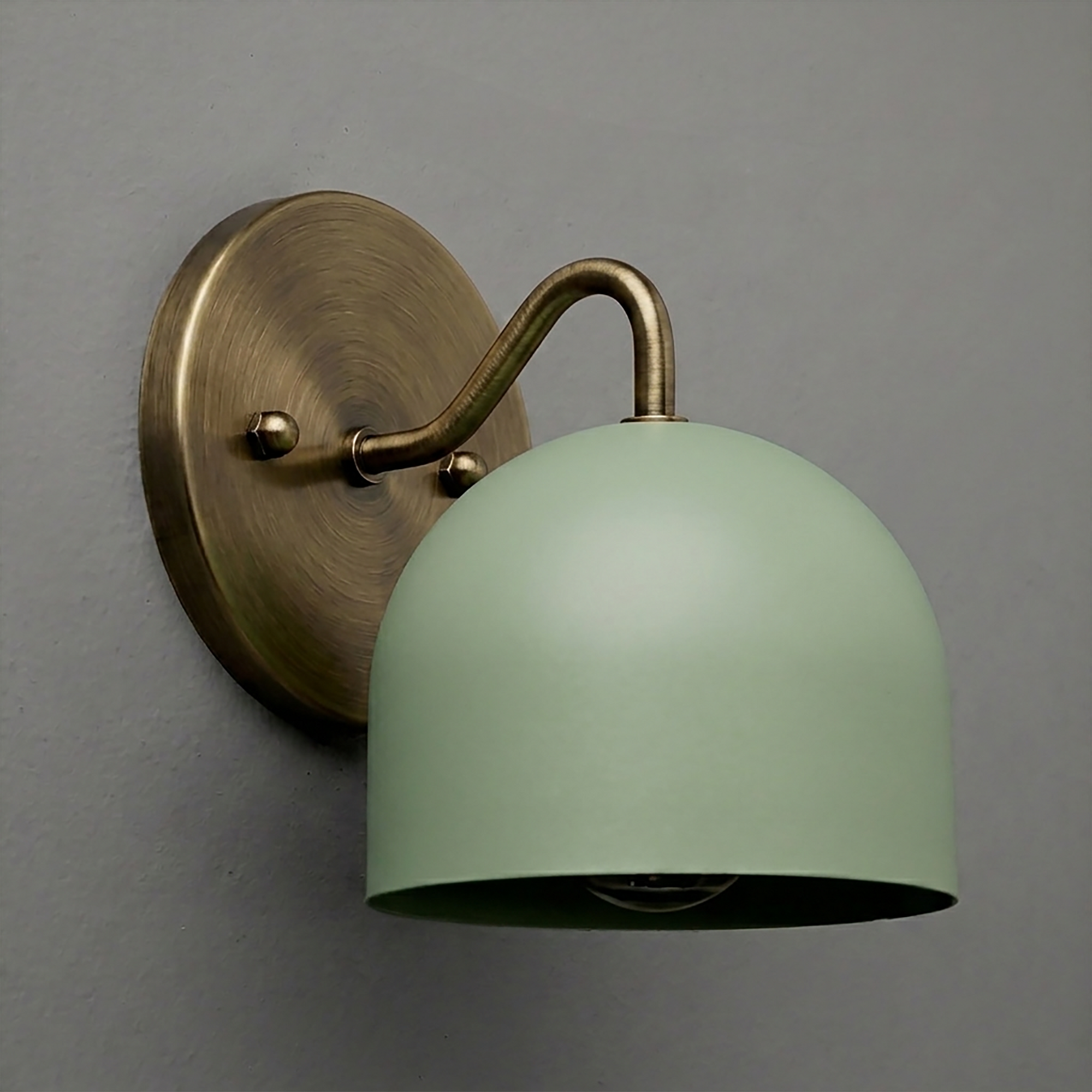 Matte green dome-shaped metal shade with curved brass arm and round brass wall mount wall sconce. - SCONCE MODEL NO. 9436