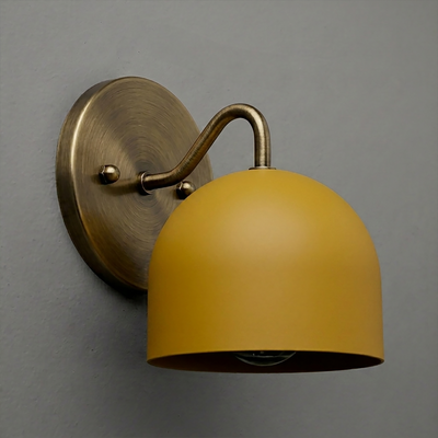 Wall-mounted sconce with matte mustard yellow dome shade and brushed brass curved arm and round backplate. - SCONCE MODEL NO. 9436