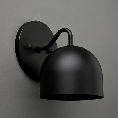 Matte black metal wall sconce with dome-shaped shade and curved arm mounting on round backplate. - SCONCE MODEL NO. 9436