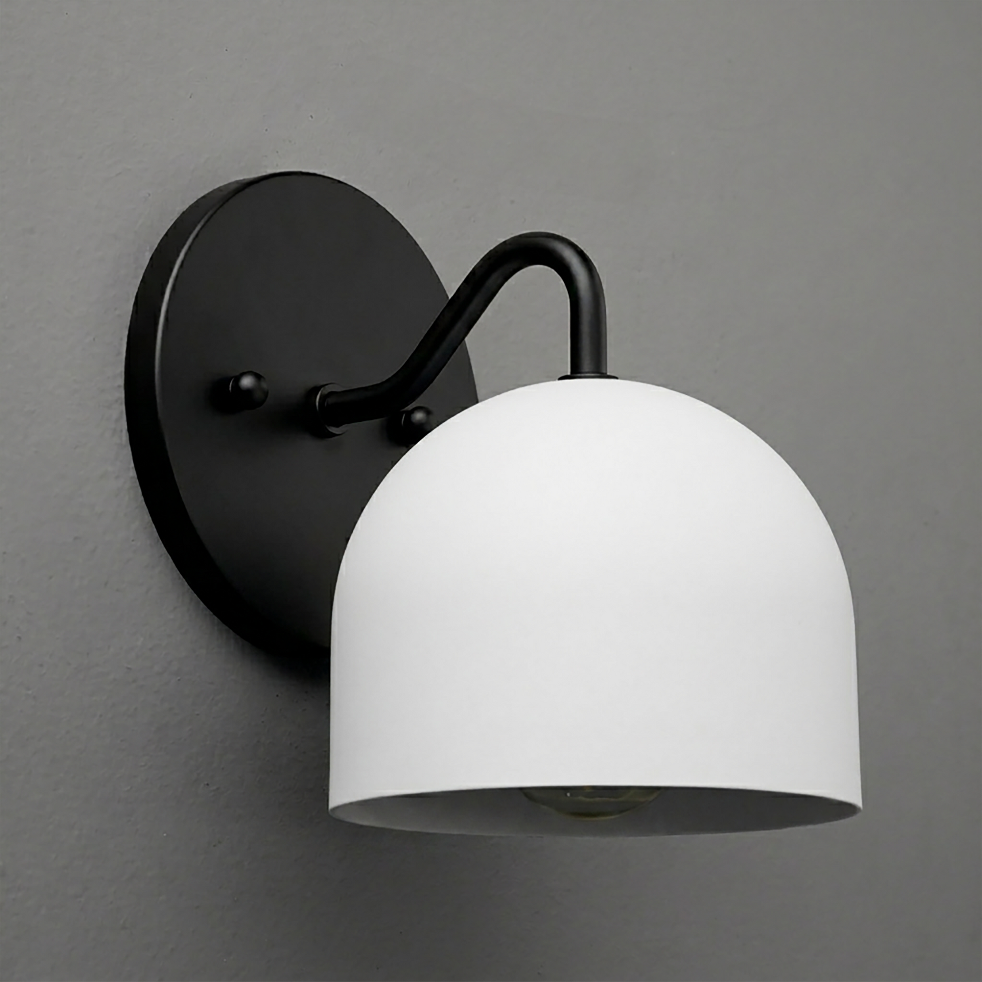 Black metal wall sconce with a curved arm and a white dome-shaped glass shade. - SCONCE MODEL NO. 9436